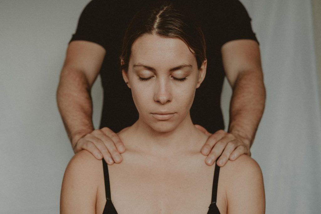 Woman getting a shoulder massage